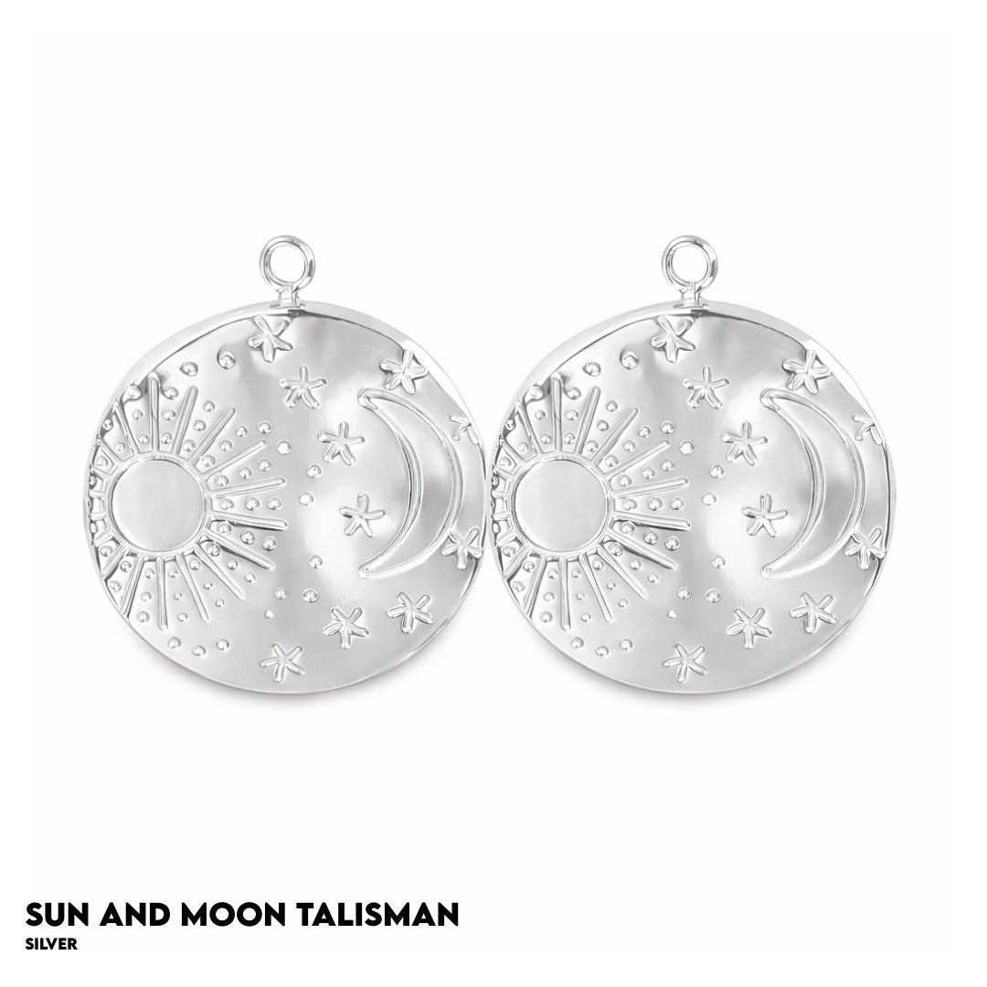 Silver sun and moon talisman on a white background